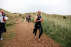 In transition from swimming to cycle during the Bamburgh Triathlon as the rain starts